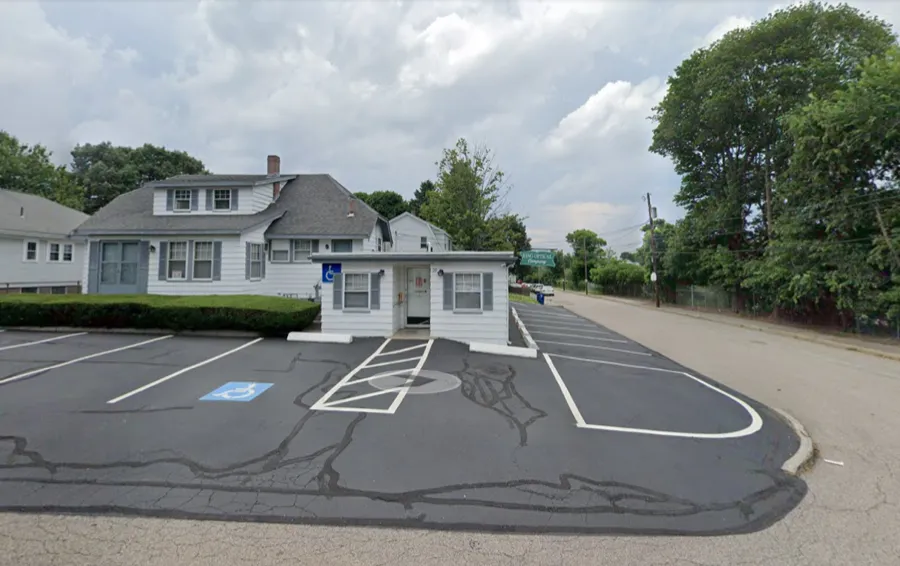 King Optical storefront and parking lot on School Street West, Braintree